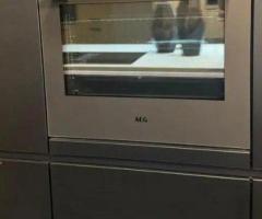 Moderne keuken met eiland en nieuw apparatuur - 7